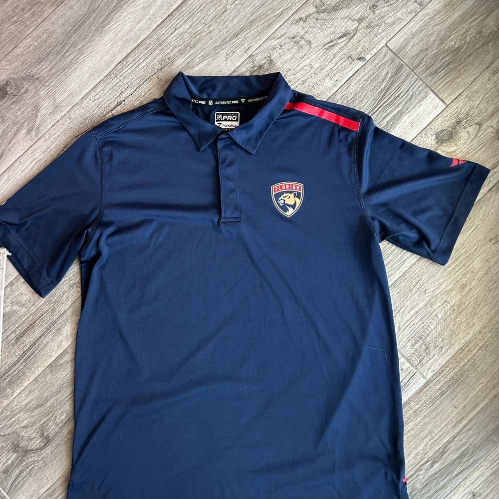 Navy Blue Florida Panthers Men’s Snap Front Polo Shirt with Red Accent. Fanatics